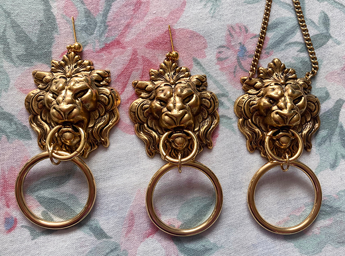 gold lion necklace and earrings
