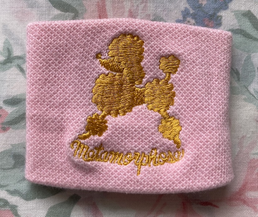 pink sweatband with gold poodle