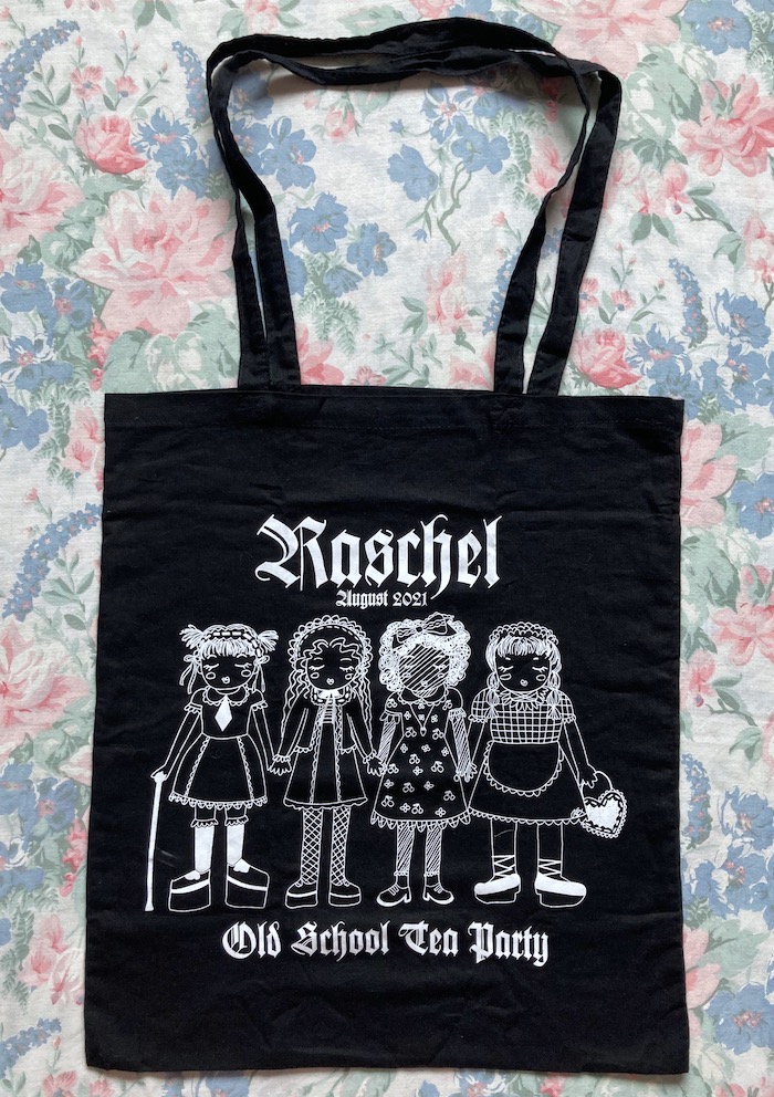 black tote with white line art of lolitas