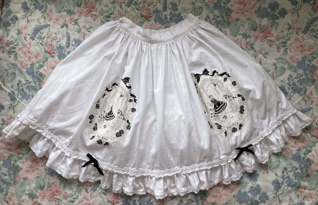 white skirt with black details