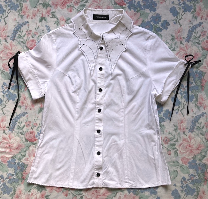 white blouse with cobweb shaped embroidered collar