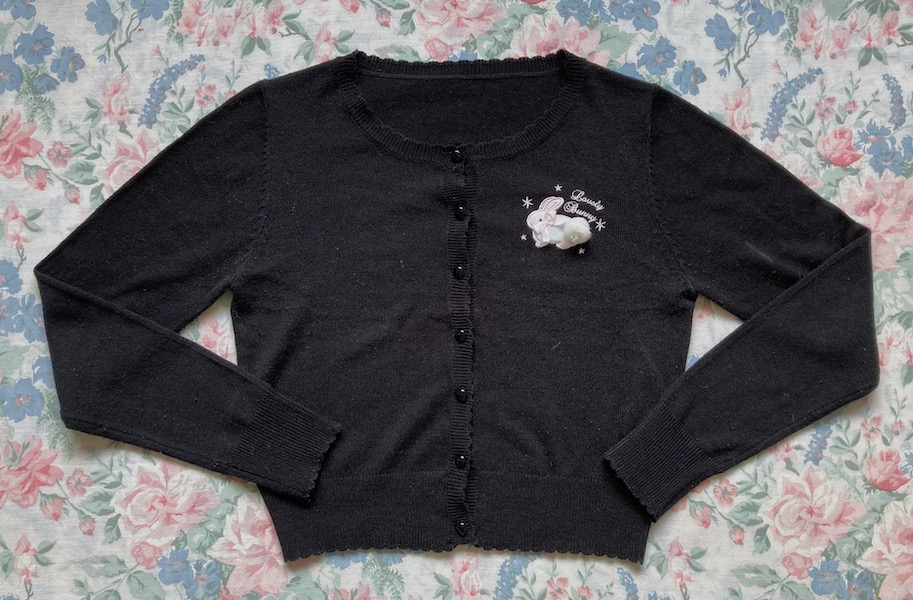 black cardigan with pink bunny